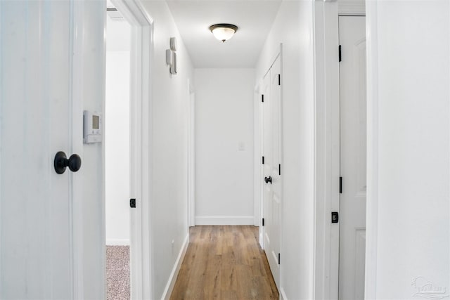 4248 Seaport Rd, Pace, FL 32571 - hallway featuring baseboards and light wood-style flooring