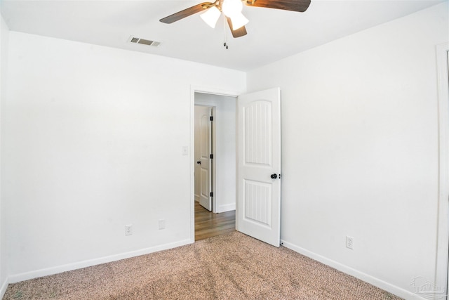 4248 Seaport Rd, Pace, FL 32571 - empty room with light carpet, ceiling fan, and baseboards