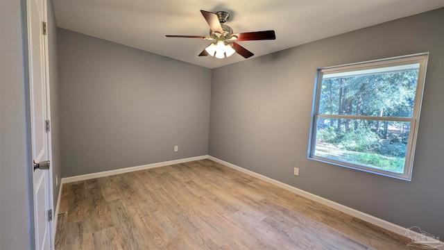 spare room with ceiling fan and light hardwood / wood-style flooring