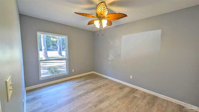 unfurnished room featuring ceiling fan and hardwood / wood-style flooring