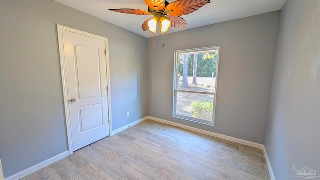 spare room with ceiling fan and light hardwood / wood-style flooring