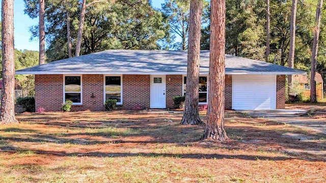 ranch-style house featuring a garage