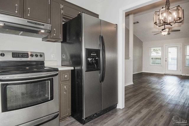 kitchen with under cabinet range hood, stainless steel appliances, dark wood-style flooring, light countertops, and pendant lighting