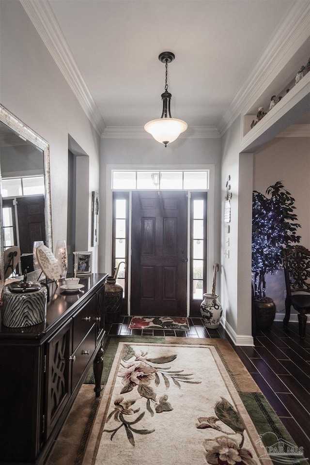 foyer with crown molding and dark hardwood / wood-style floors