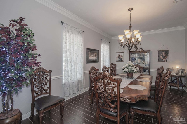 dining area featuring ornamental molding and an inviting chandelier