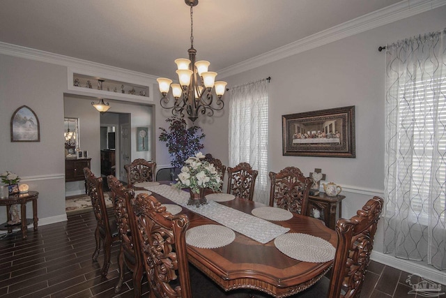 dining space with ornamental molding and a notable chandelier