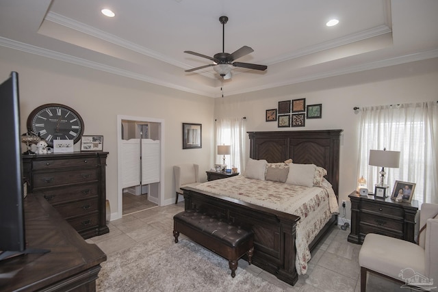 bedroom with crown molding, ceiling fan, and a tray ceiling