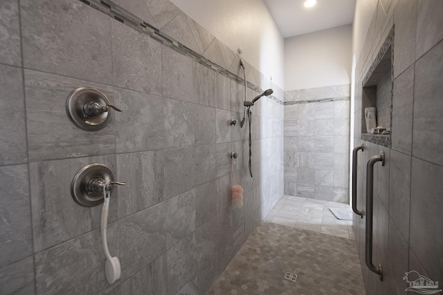 bathroom with a tile shower