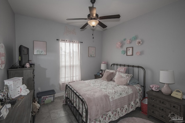 bedroom featuring light tile patterned flooring and ceiling fan