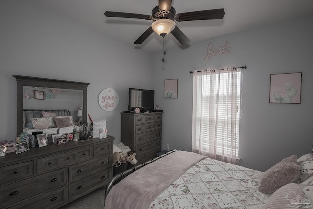 bedroom featuring multiple windows and ceiling fan