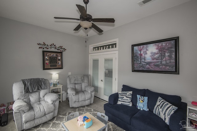 living room featuring french doors and ceiling fan