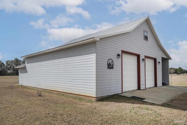 garage featuring a yard