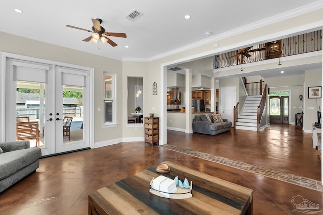 living room with french doors, ceiling fan, dark tile patterned floors, and crown molding