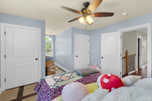 bedroom featuring hardwood / wood-style flooring and ceiling fan