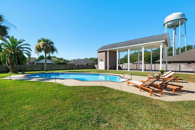 view of swimming pool featuring a yard and a patio