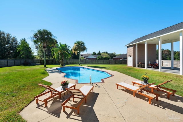 view of pool featuring a patio and a lawn