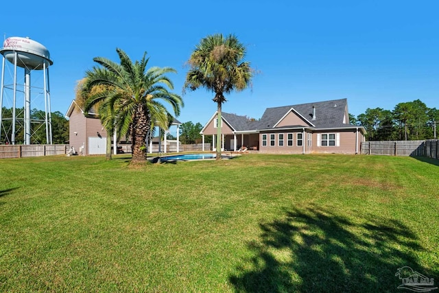 view of yard with a fenced in pool