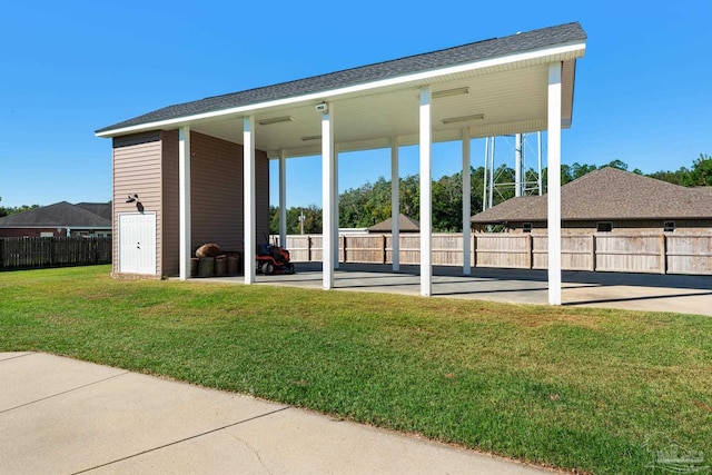 view of car parking with a lawn