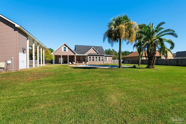 view of yard with a pool