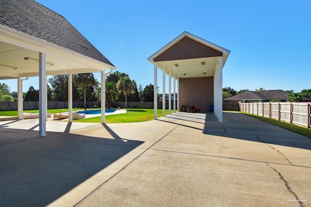 view of patio with a fenced in pool