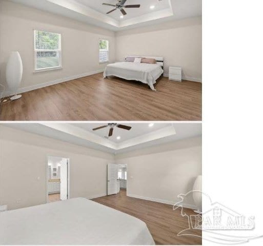 bedroom with hardwood / wood-style flooring, a raised ceiling, and ceiling fan