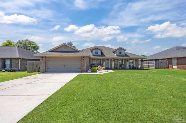 6018 Autumn Pines Cir, Pace, FL 32571 - view of front facade with brick siding, an attached garage, fence, and a front yard