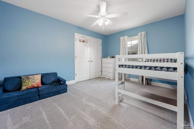 6018 Autumn Pines Cir, Pace, FL 32571 - carpeted bedroom with baseboards, a ceiling fan, and a closet