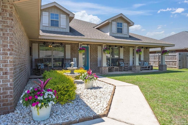 6018 Autumn Pines Cir, Pace, FL 32571 - view of front of property featuring a ceiling fan, fence, a front yard, brick siding, and roof with shingles