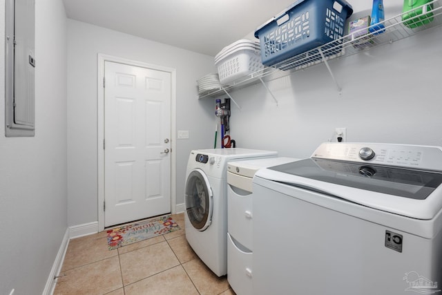 6018 Autumn Pines Cir, Pace, FL 32571 - laundry room with washer and clothes dryer, light tile patterned flooring, electric panel, baseboards, and laundry area