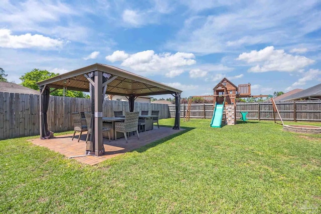 6018 Autumn Pines Cir, Pace, FL 32571 - view of yard with a gazebo, a fenced backyard, a patio, and a playground