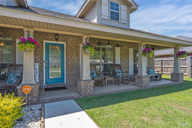 6018 Autumn Pines Cir, Pace, FL 32571 - entrance to property with fence, a yard, board and batten siding, covered porch, and brick siding
