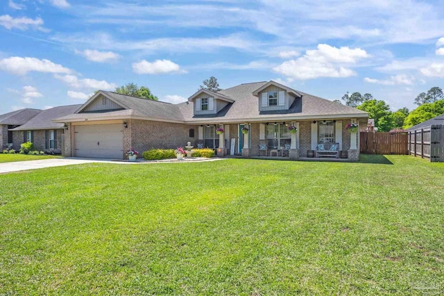 6018 Autumn Pines Cir, Pace, FL 32571 - view of front of home featuring brick siding, fence, a garage, and a front yard
