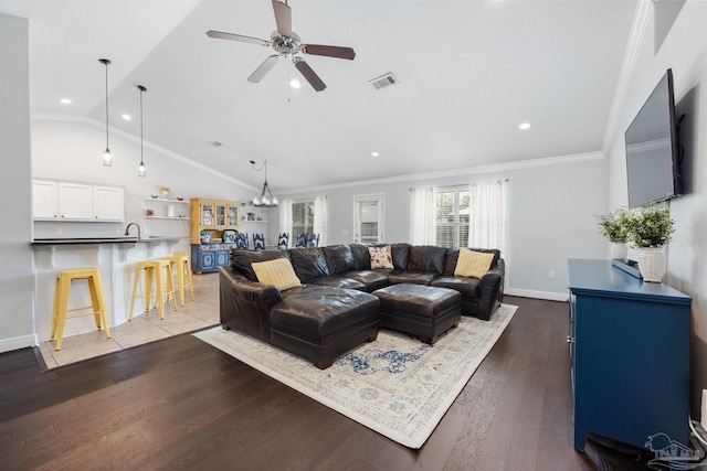 6018 Autumn Pines Cir, Pace, FL 32571 - living room featuring recessed lighting, lofted ceiling, visible vents, crown molding, and ceiling fan with notable chandelier