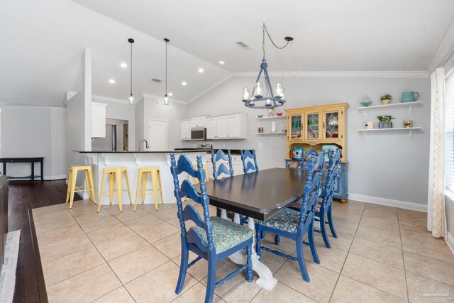 6018 Autumn Pines Cir, Pace, FL 32571 - dining area with lofted ceiling, an inviting chandelier, visible vents, crown molding, and baseboards