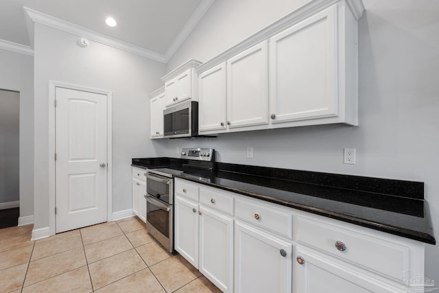 6018 Autumn Pines Cir, Pace, FL 32571 - kitchen featuring stainless steel appliances, dark countertops, baseboards, white cabinetry, and crown molding