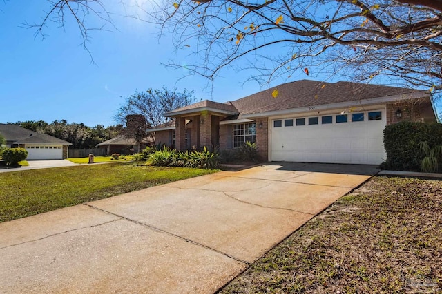 single story home featuring a garage and a front lawn