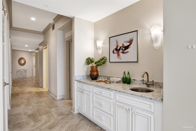 bathroom featuring vanity and crown molding