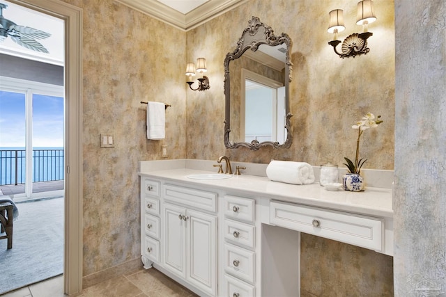 bathroom with crown molding, vanity, and tile patterned flooring