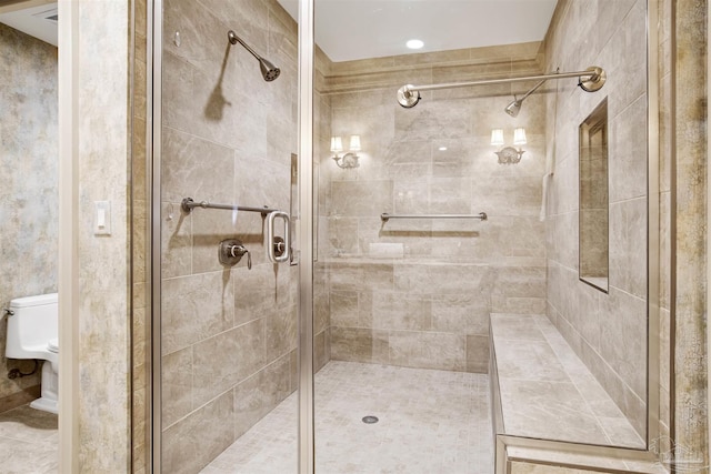 bathroom featuring walk in shower and toilet