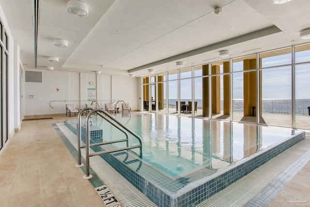 view of swimming pool featuring a water view