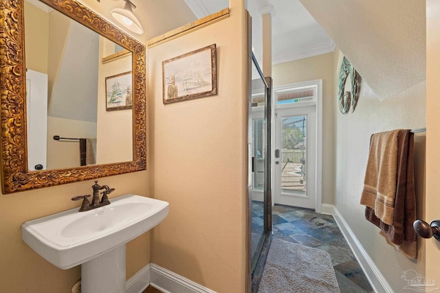 bathroom with ornamental molding and tile patterned floors