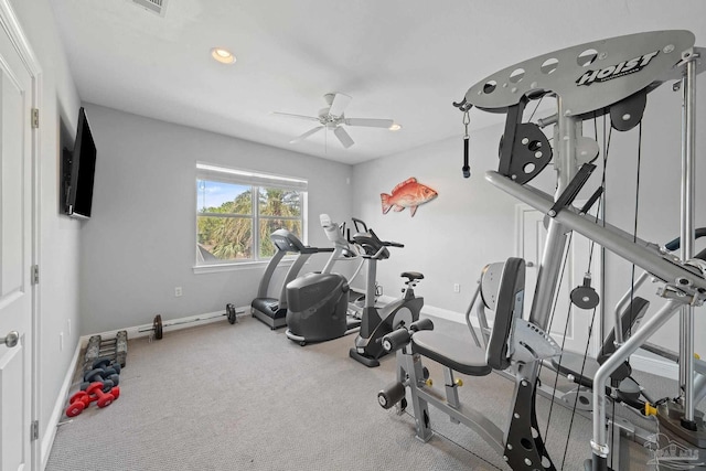 exercise area with carpet floors and ceiling fan