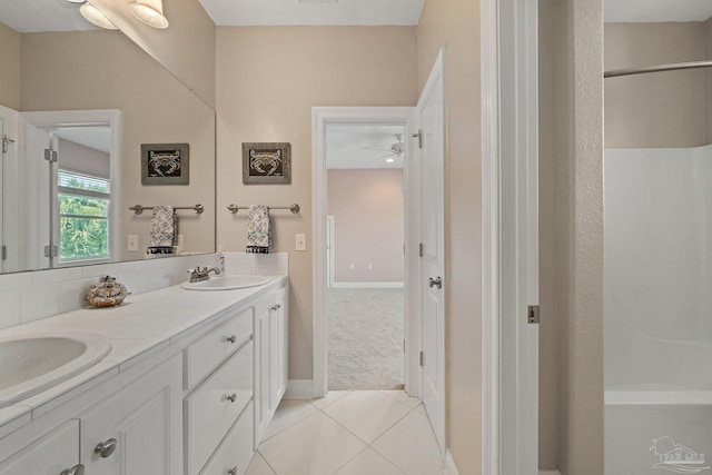 bathroom with dual vanity, tile patterned flooring, and ceiling fan