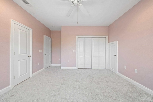 unfurnished bedroom with carpet and ceiling fan