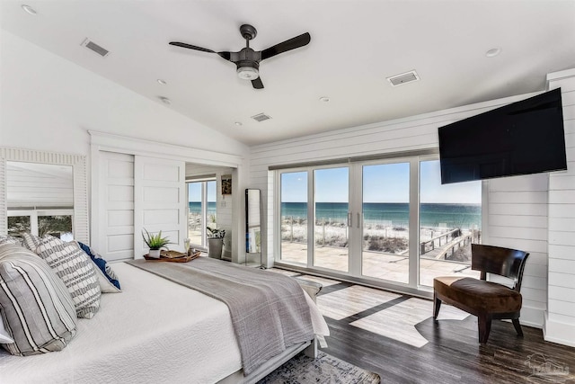 bedroom with access to exterior, multiple windows, ceiling fan, and wood-type flooring