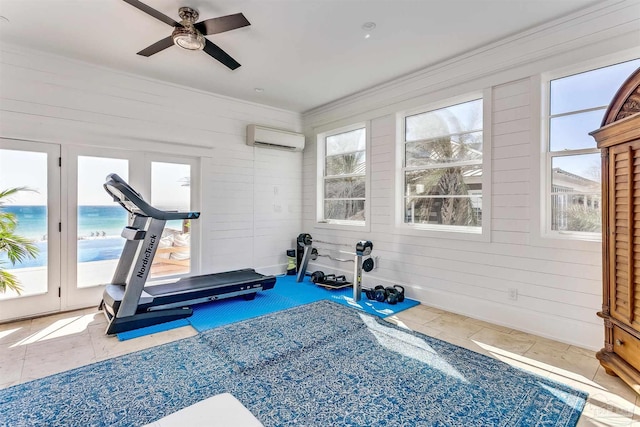 exercise room featuring a wall mounted AC, tile patterned flooring, a water view, ceiling fan, and ornamental molding