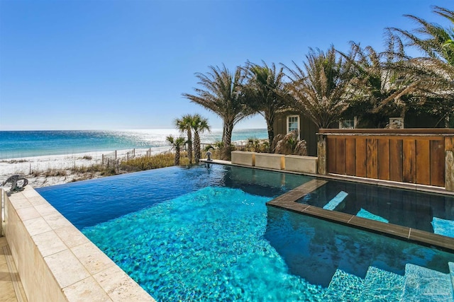 view of pool featuring a water view