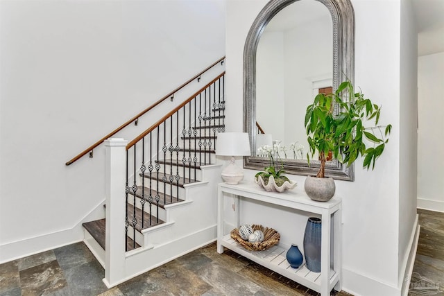 staircase with dark wood-type flooring