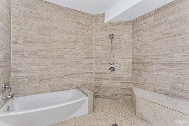 bathroom featuring tile patterned flooring and tile walls