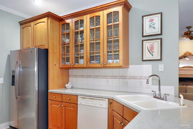 kitchen with sink, backsplash, white dishwasher, ornamental molding, and stainless steel fridge with ice dispenser